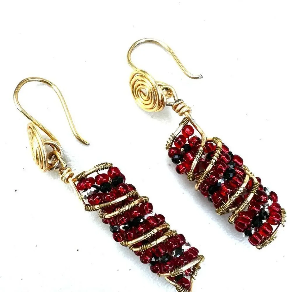 Red beaded gold tone drop earrings